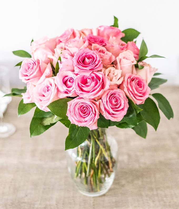 Two Dozen Light Pink Long Stem Roses in a Clear Glass Vase at From You Flowers