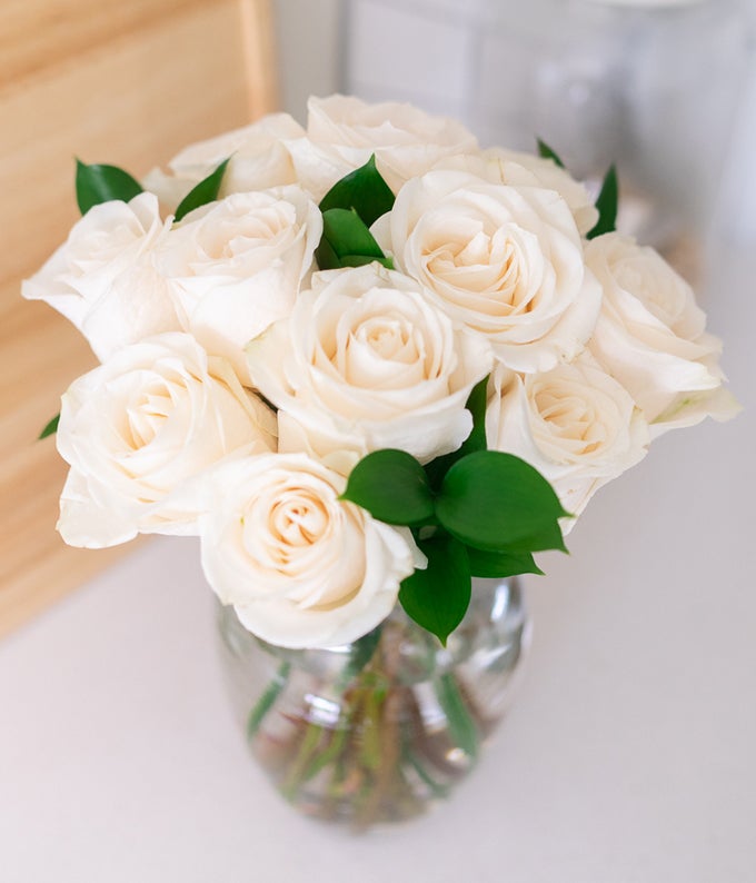 One Dozen White Roses in Clear Glass Vase