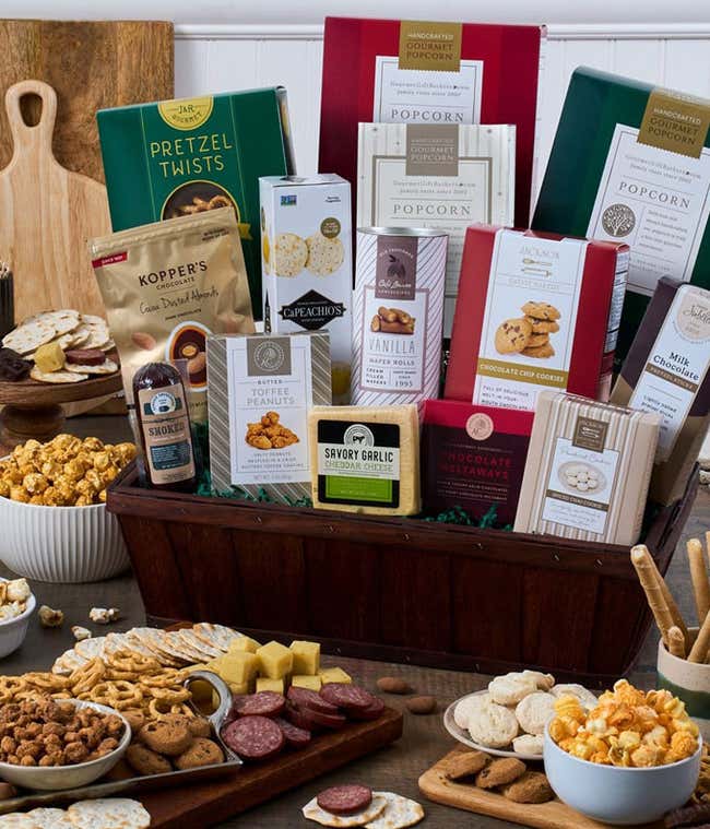 Gourmet snack basket with cheese, popcorn, sausage and more