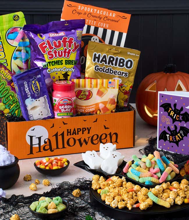 Gift Box with spider web cotton candy, caramel popcorn, haribo goldbears, halloween junior mints, plain m&amp;m's, sugar babies, ghost dots, kettle corn, gummy worms, black &amp; white cookies, and candy corn