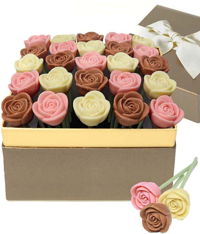  chocolate rose gift box featuring red and milk chocolate rose-shaped candies arranged in a gold-trimmed box, with a ribboned gift lid and two chocolate rose pops displayed in front.