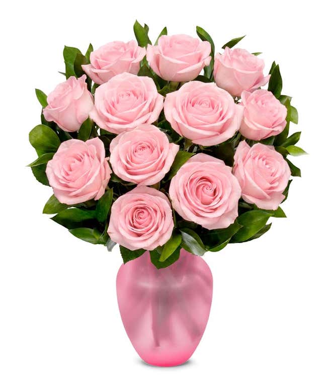 A delicate arrangement featuring one dozen light pink roses. This elegant and timeless display offers a touch of romance and sophistication, perfect for any special occasion.