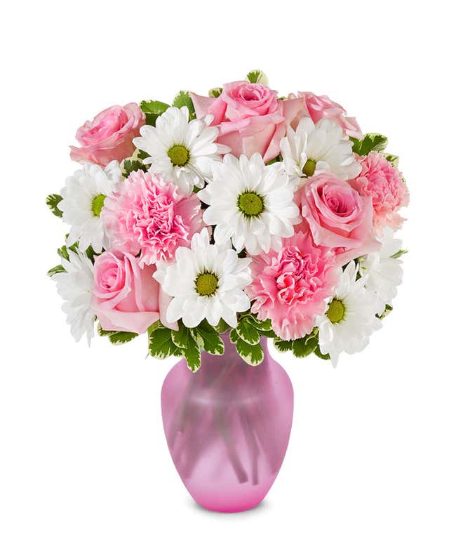 Floral arrangement featuring pink roses, white daisies, and pink carnations, optionally in a vase.