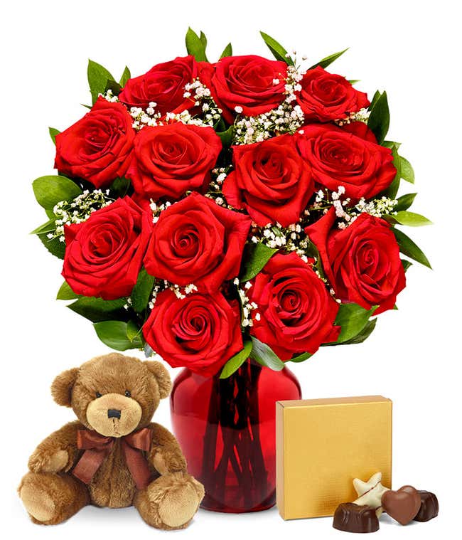 A romantic gift set featuring long stem red roses, a box of chocolates, and a plush teddy bear. This perfect combination offers a heartfelt and memorable display for any special occasion.