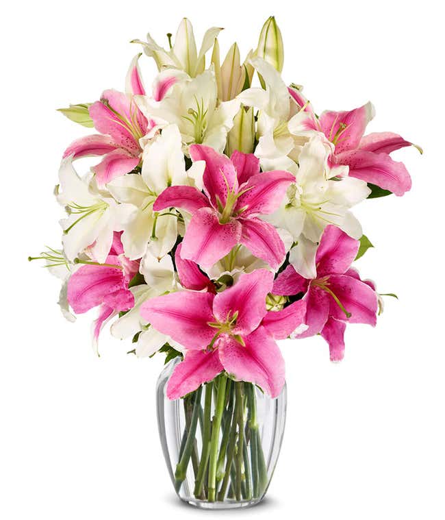 A bouquet featuring pink lilies and white lilies, with an optional glass vase.