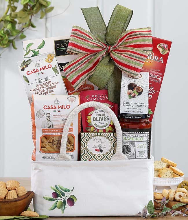 Gift basket with Italian gourmet treats and a green bow.