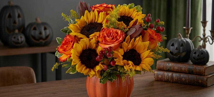 Florist designing a summer floral arrangement